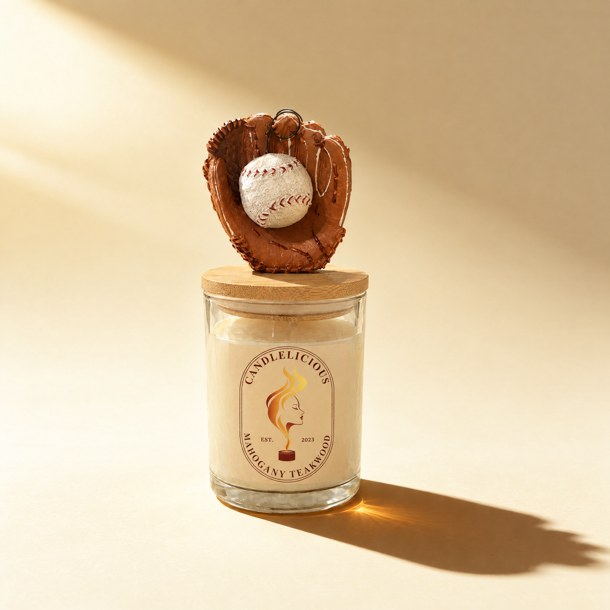 Mahogany Teakwood candle with a leather baseball glove and ball on the lid