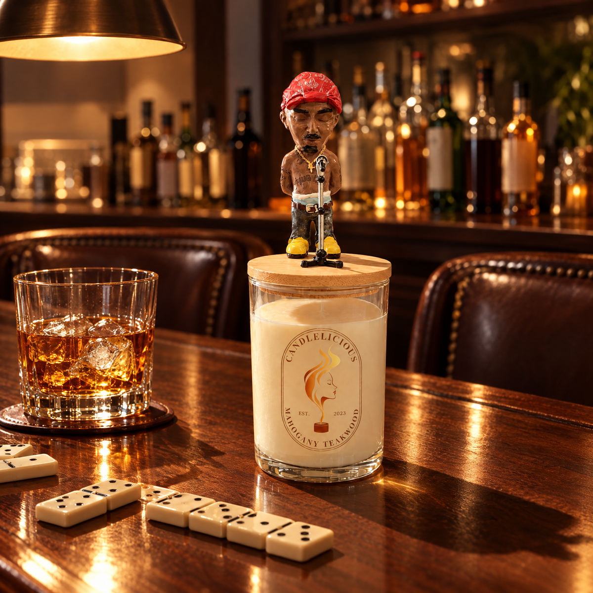 Mahogany Teakwood candle on a basement bar with dominoes and a drink