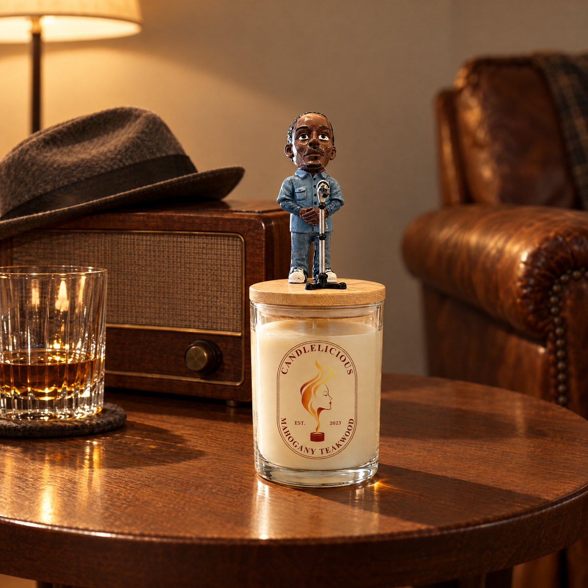 Mahogany Teakwood candle on a side table beside a vintage radio and a fedora