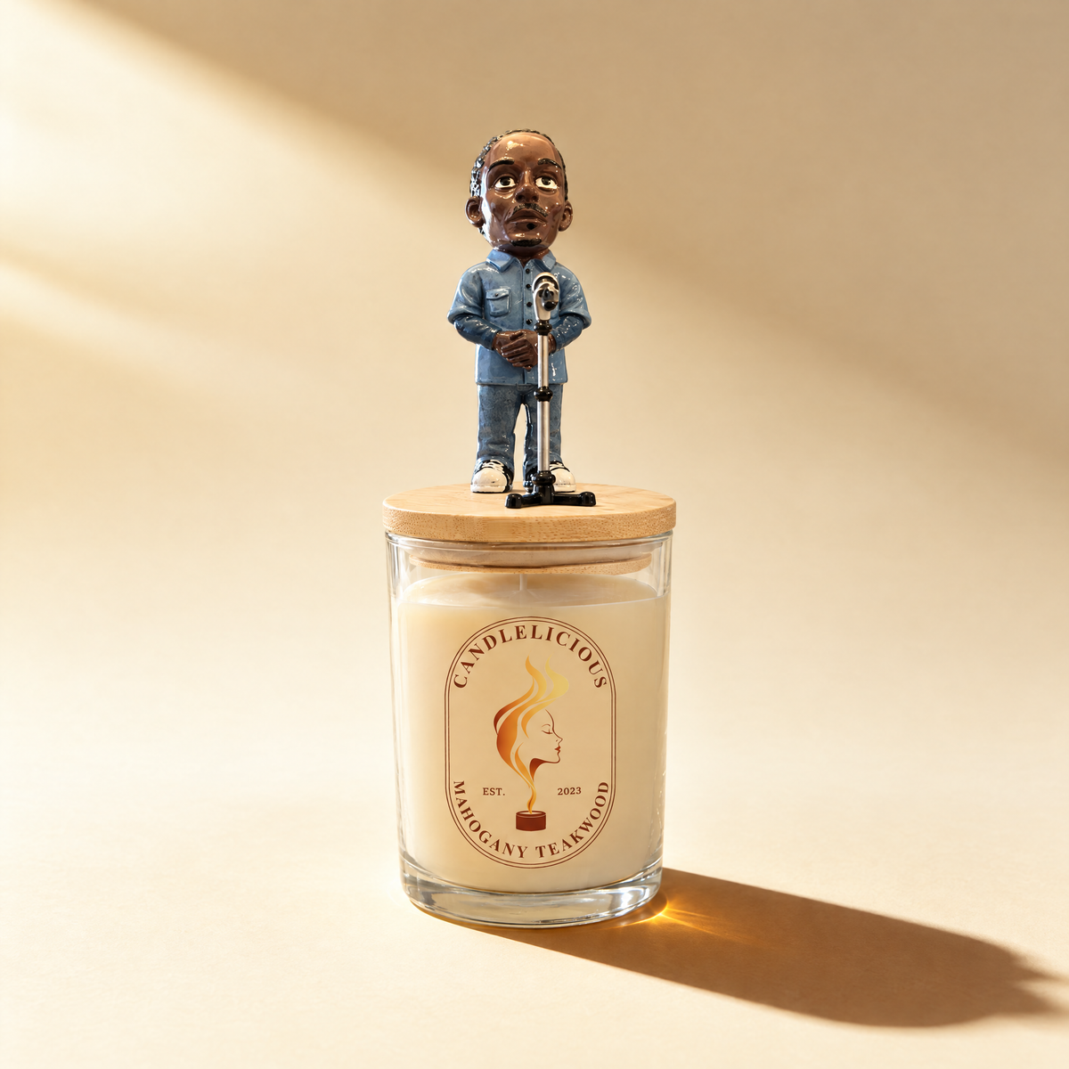 Mahogany Teakwood candle with a figurine in denim at a microphone on the lid