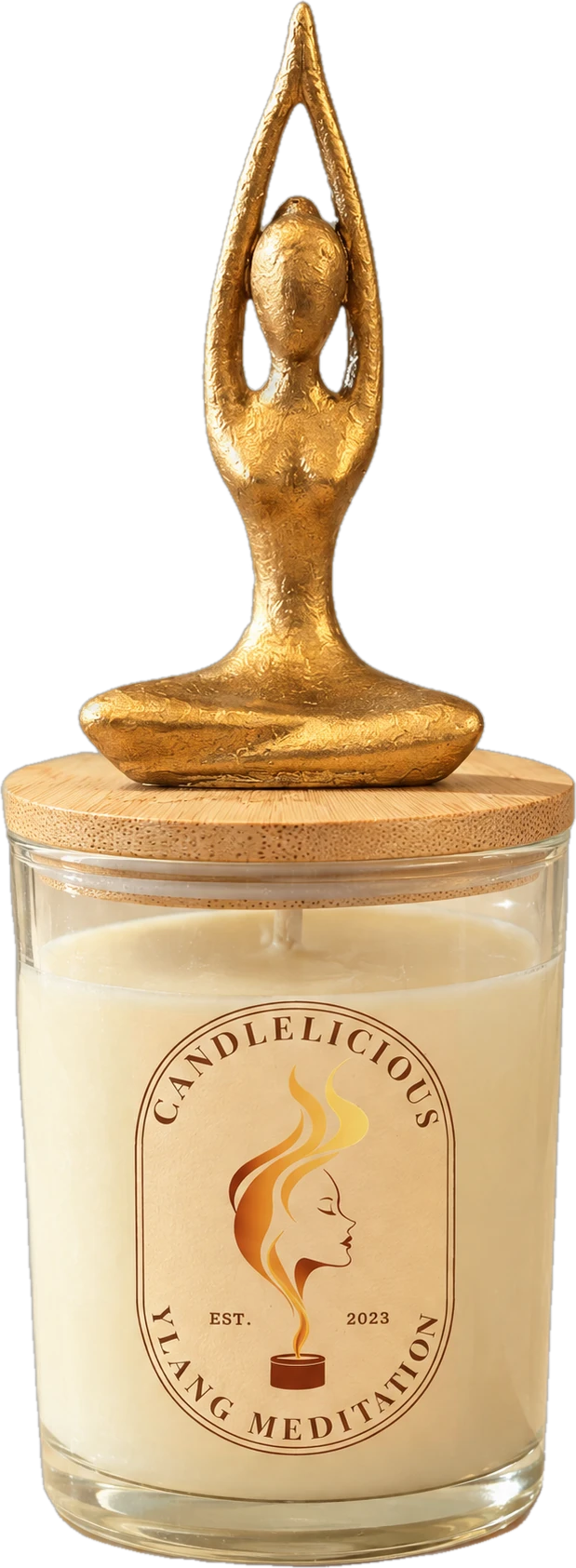 Ylang Meditation candle with a gold seated yoga figure, arms raised, on the lid